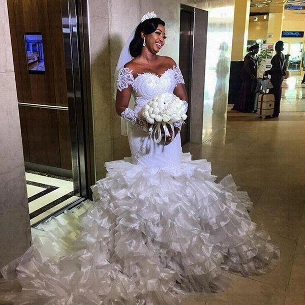 Image of ENM 727366738 charming ruffles african mermaid wedding dresses 2021 sheer neck lace bridal gowns gorgeous tiered organza bride dress