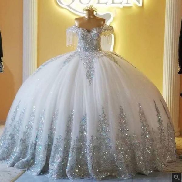 Image of ENM 728299679 2021 silver sparkly ball gown wedding dresses off shoulder lace tulle applique brides gown long robe de mariage