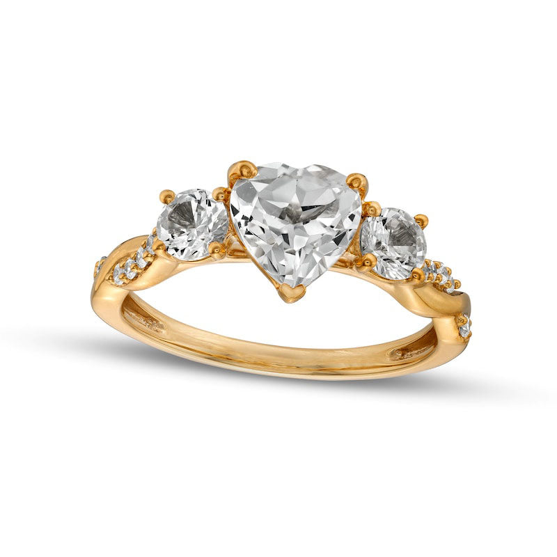 Image of ID 1 Heart-Shaped White Lab-Created Sapphire and 010 CT TW Diamond Three Stone Twist Shank Engagement Ring in Solid 10K Yellow Gold