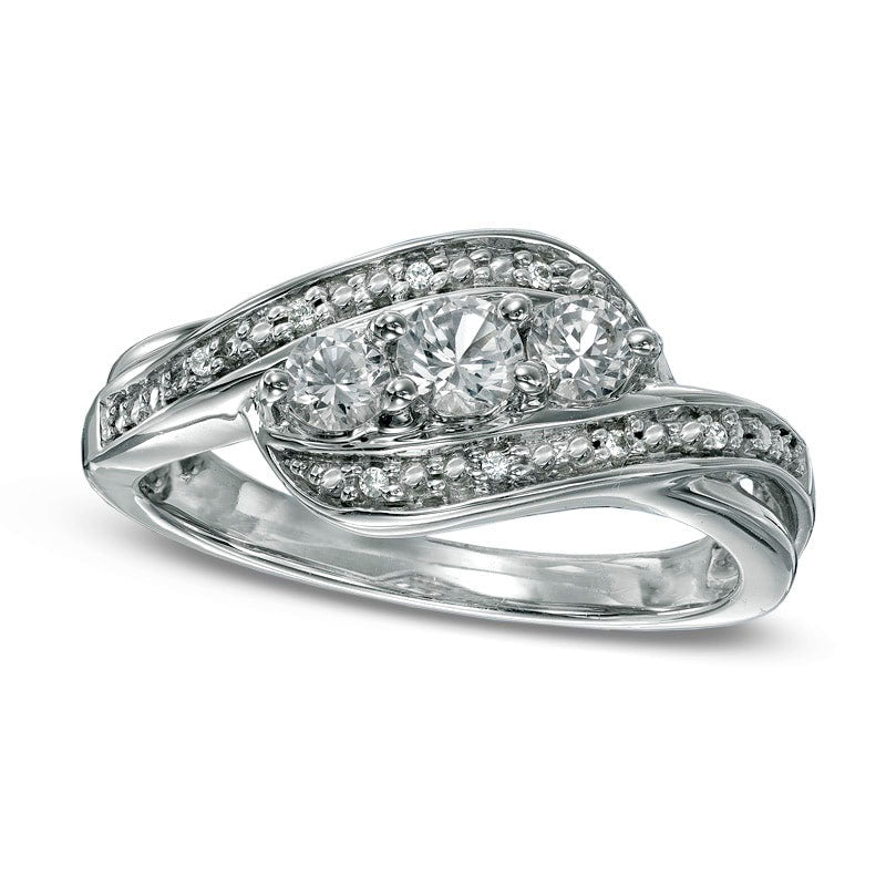 Image of ID 1 Lab-Created White Sapphire and Diamond Accent Three Stone Ribbon Promise Ring in Sterling Silver