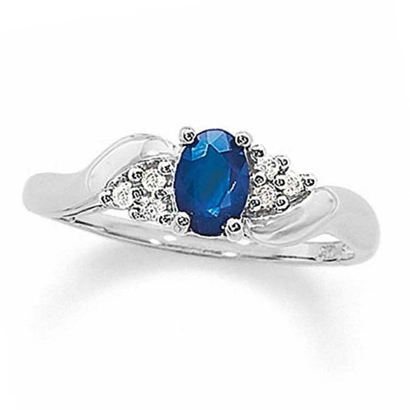 Image of ID 1 Oval Blue Sapphire and 005 CT TW Natural Diamond Twist Ring in Solid 10K White Gold