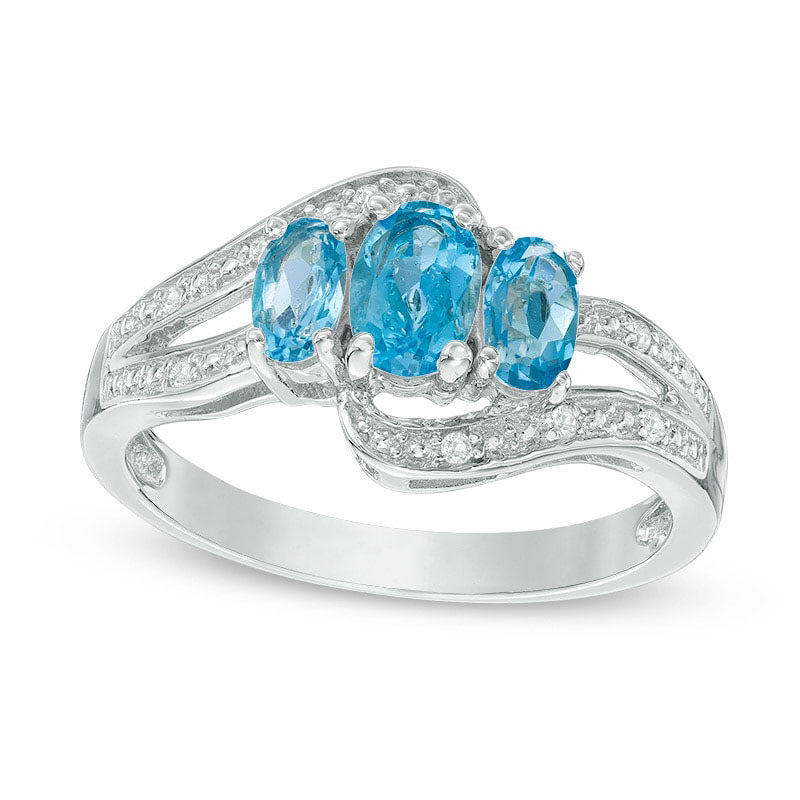 Image of ID 1 Oval Blue and White Topaz Three Stone Bypass Ring in Sterling Silver
