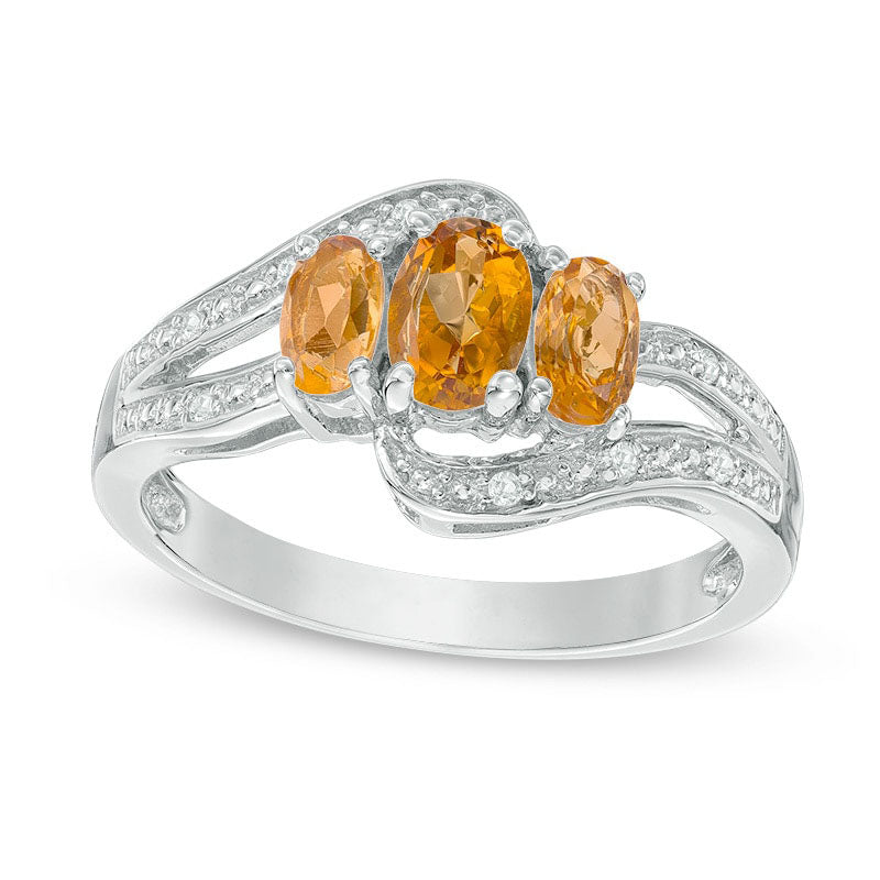 Image of ID 1 Oval Citrine and White Topaz Three Stone Bypass Ring in Sterling Silver