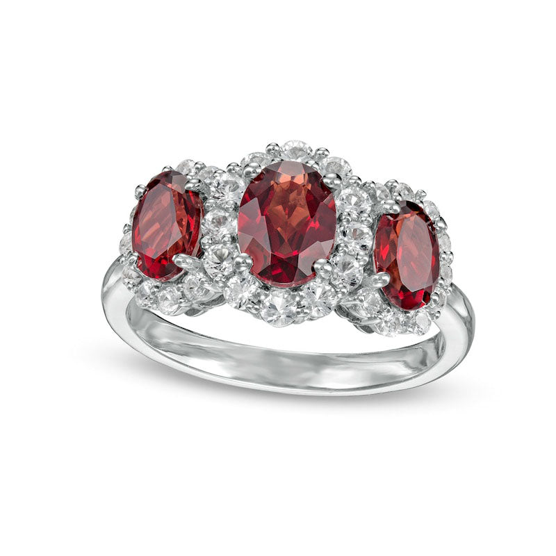 Image of ID 1 Oval Garnet and White Lab-Created Sapphire Frame Three Stone Ring in Sterling Silver