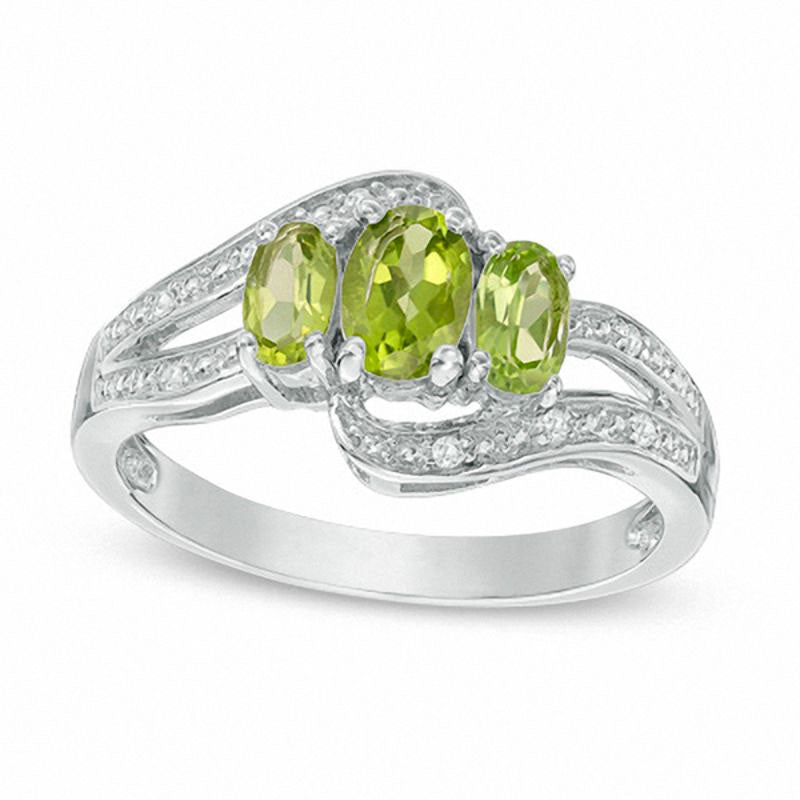 Image of ID 1 Oval Peridot and White Topaz Three Stone Bypass Ring in Sterling Silver
