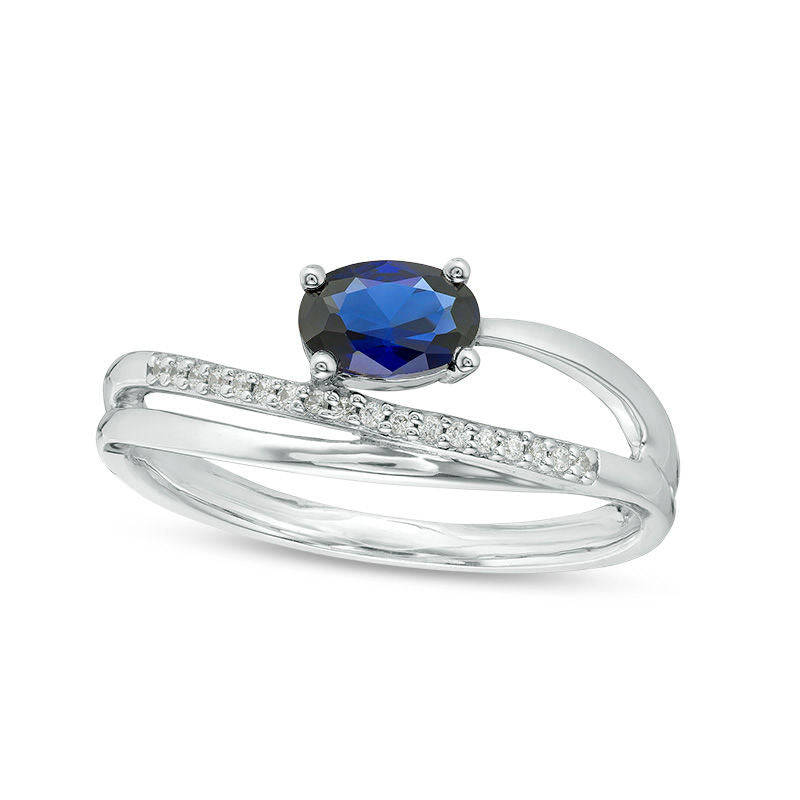 Image of ID 1 Sideways Oval Lab-Created Blue Sapphire and 005 CT TW Diamond Crossover Ribbon Promise Ring in Sterling Silver